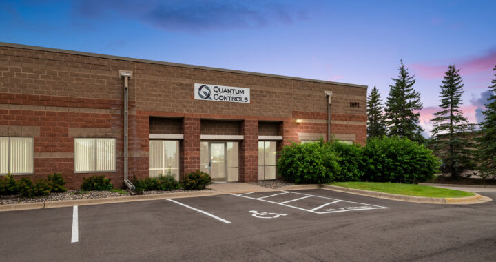 Exterior of Quantum Controls commercial building at twilight